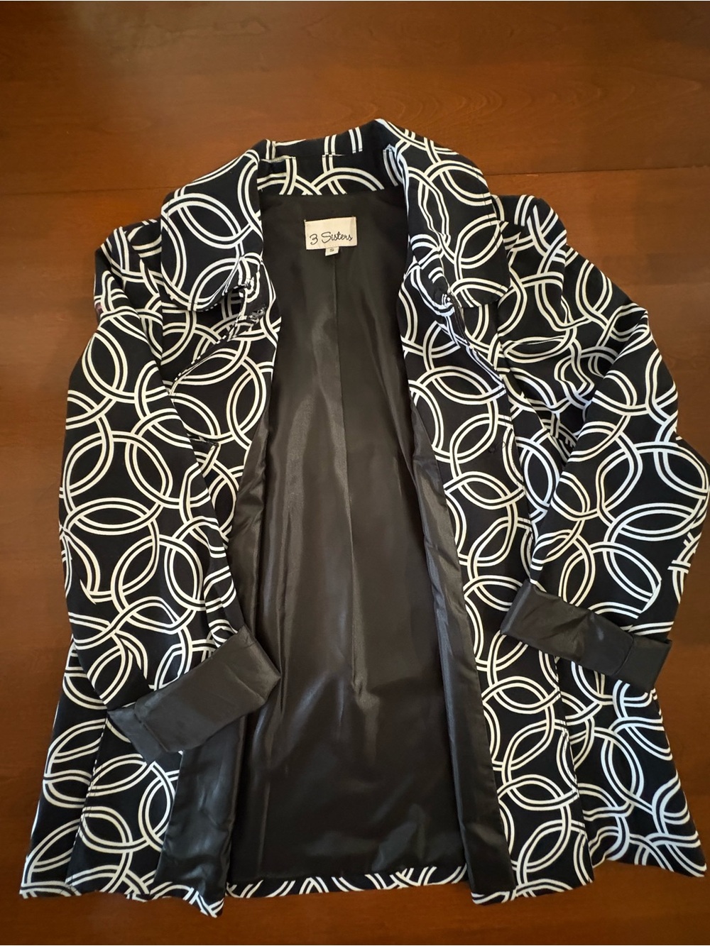 3 Sisters Black Trench Coat with White Interlocking Ring Print